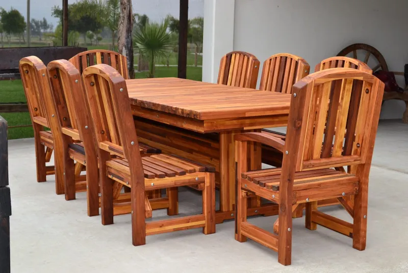 A redwood dining table with chairs