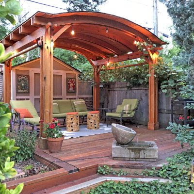 Backyard Pavilion Kits (Options: 10' L x 12' Arc W, Douglas-fir, 2 Post Electrical Wiring Trim, 4-Post Anchor Kit for Wood, No Ceiling Fan Base, No Privacy Panels, 2 Curtain Rods, 9 ft Post Height, Transparent Premium Sealant). Photo Courtesy of Paul Upsons of Denver, Colorado.